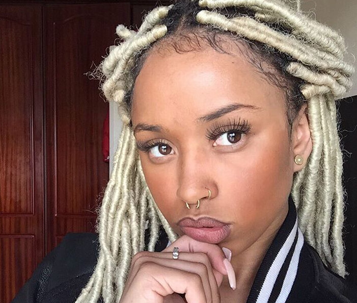 faux blonde dreadlocks hairstyle in a half-up hairstyle