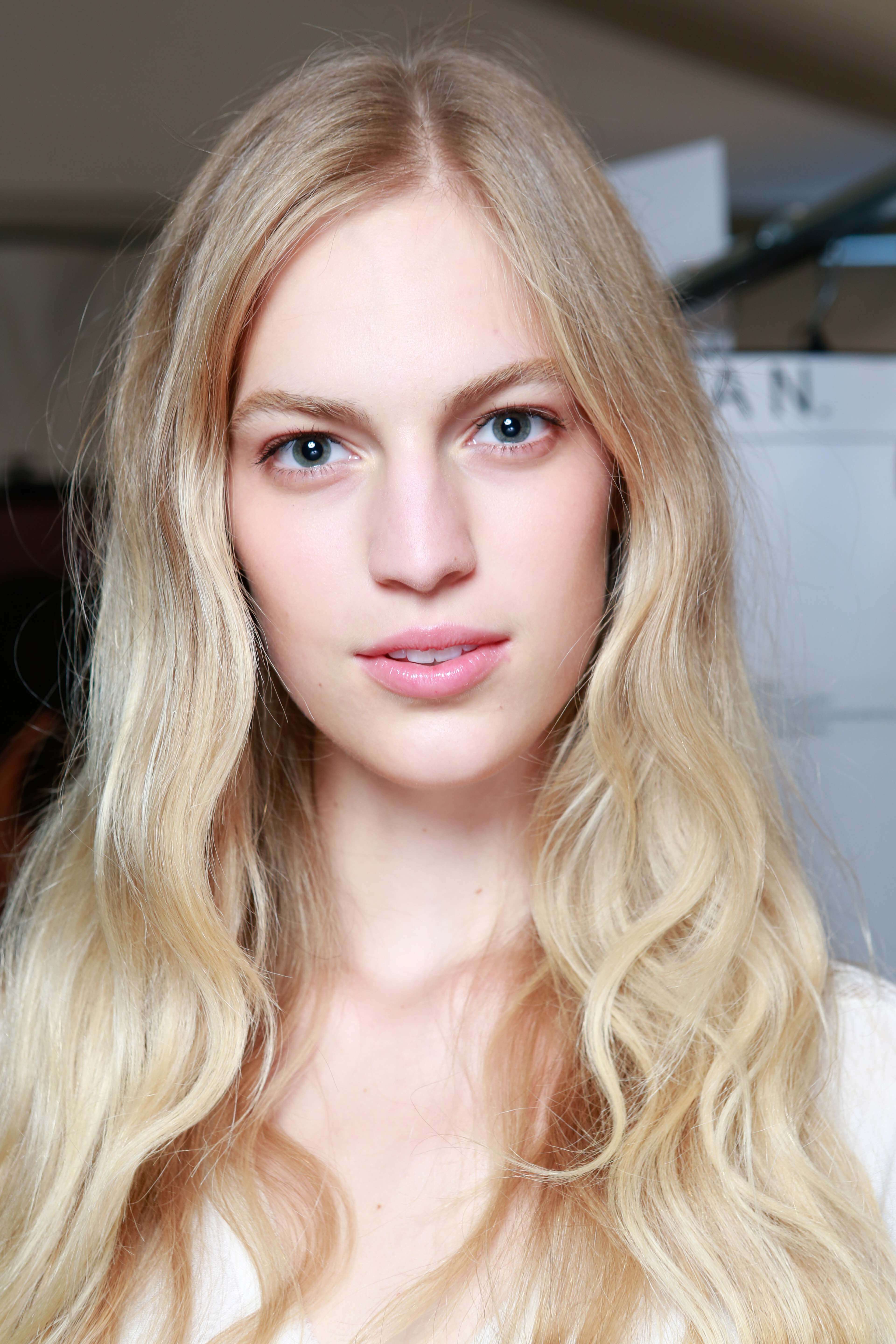 long layered haircut on blonde model with loose waves