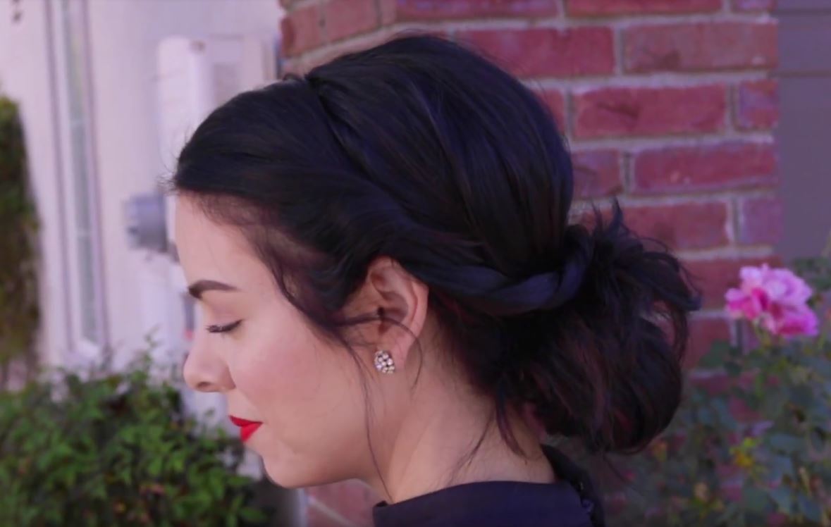 Messy bun: YouTuber Nikki Phillippi with a pretty twisted messy bun hairstyle on her dark brunette hair