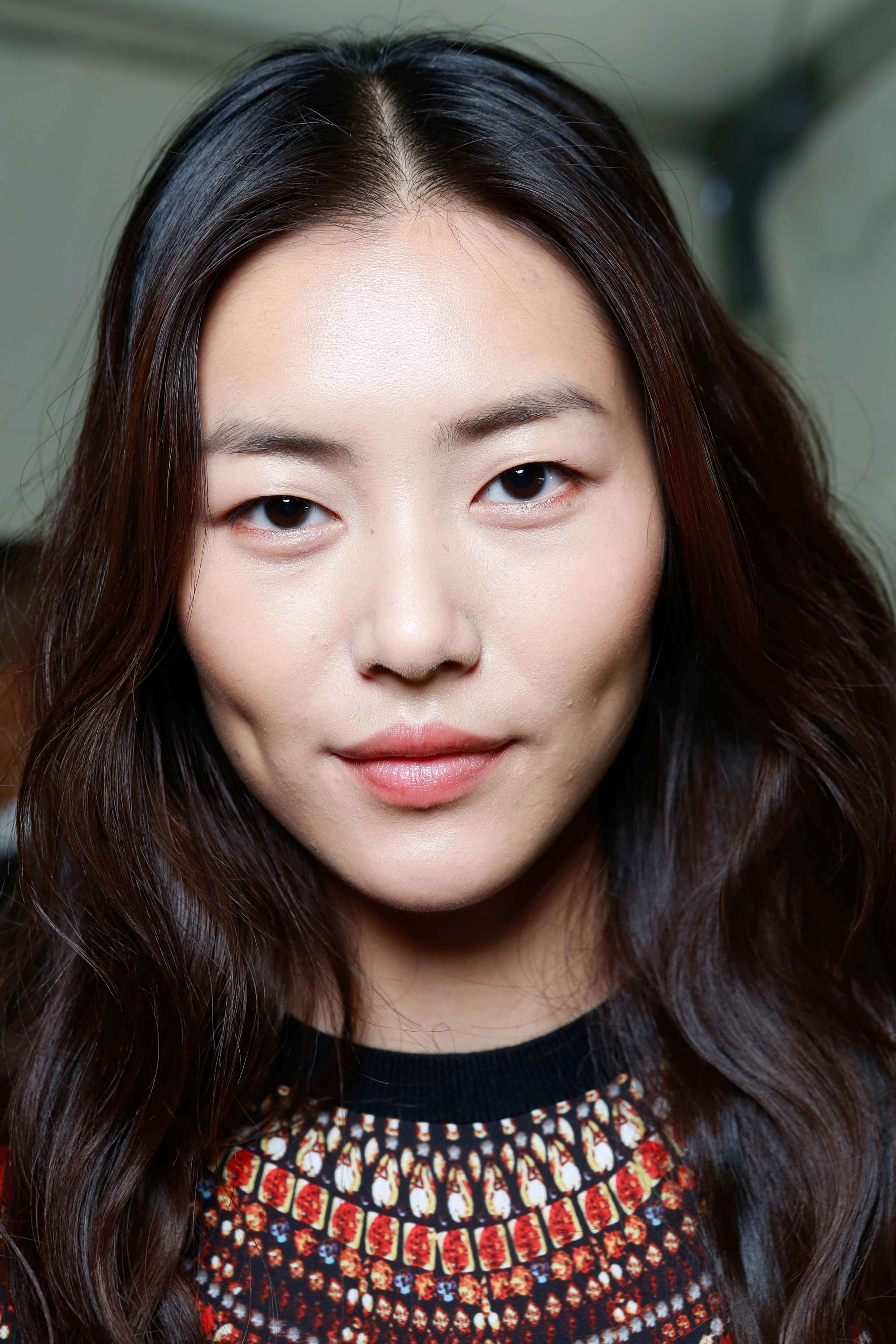 Asian model with medium length wavy hair from the Diane Von Furstenberg SS14