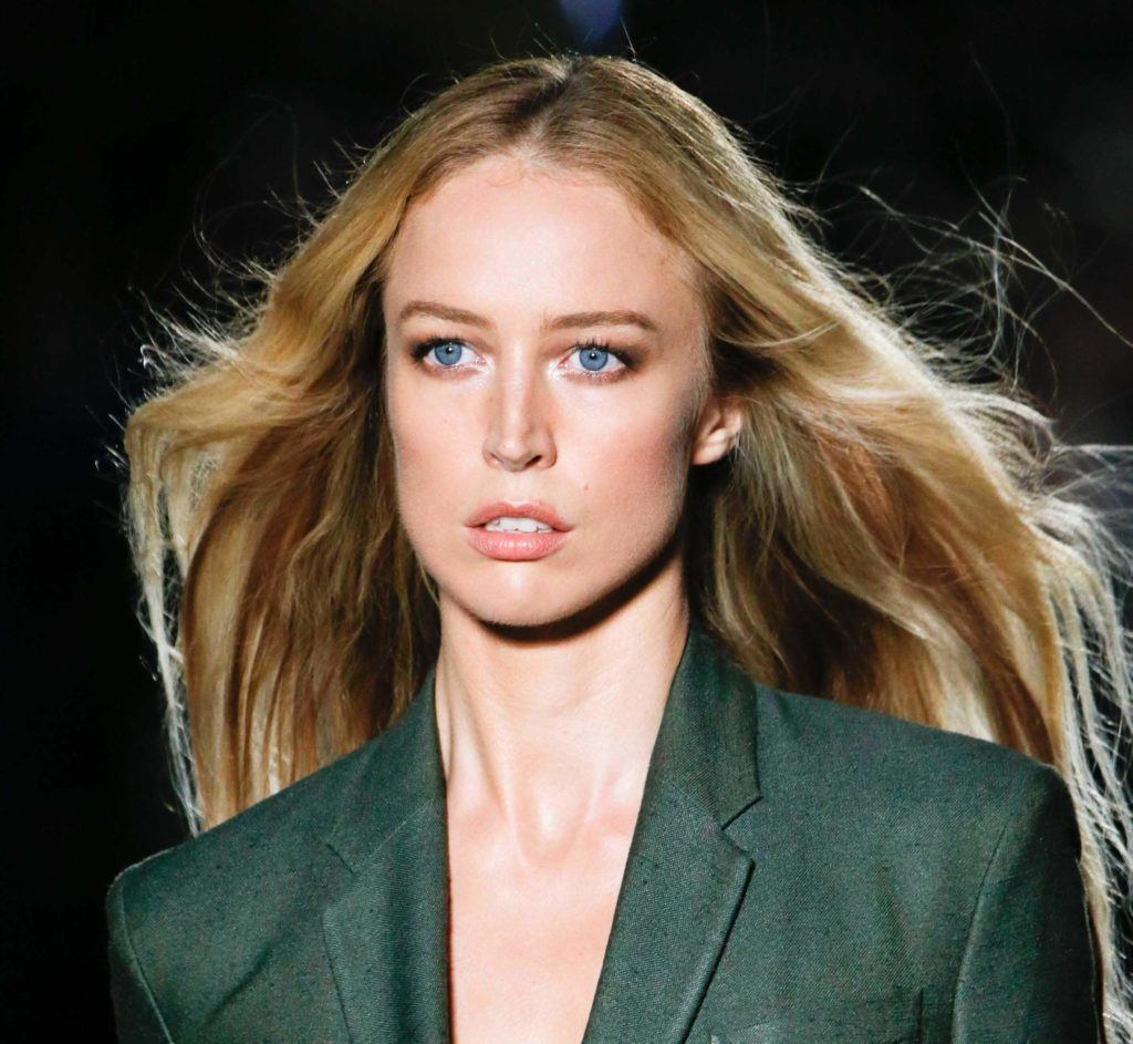 front view of a woman with long dark blonde hair worn down