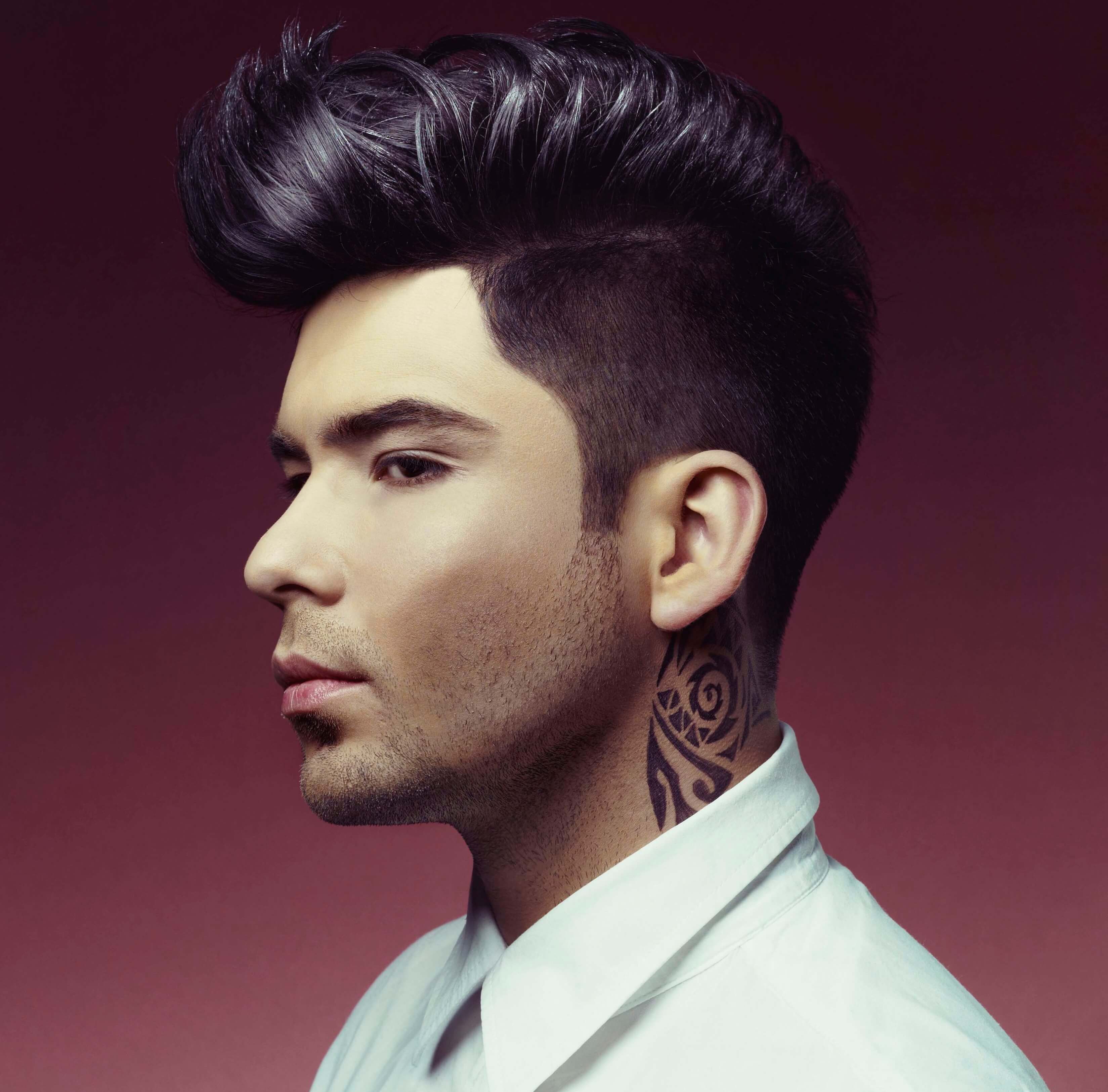 Dark haired man with Mohawk and fade
