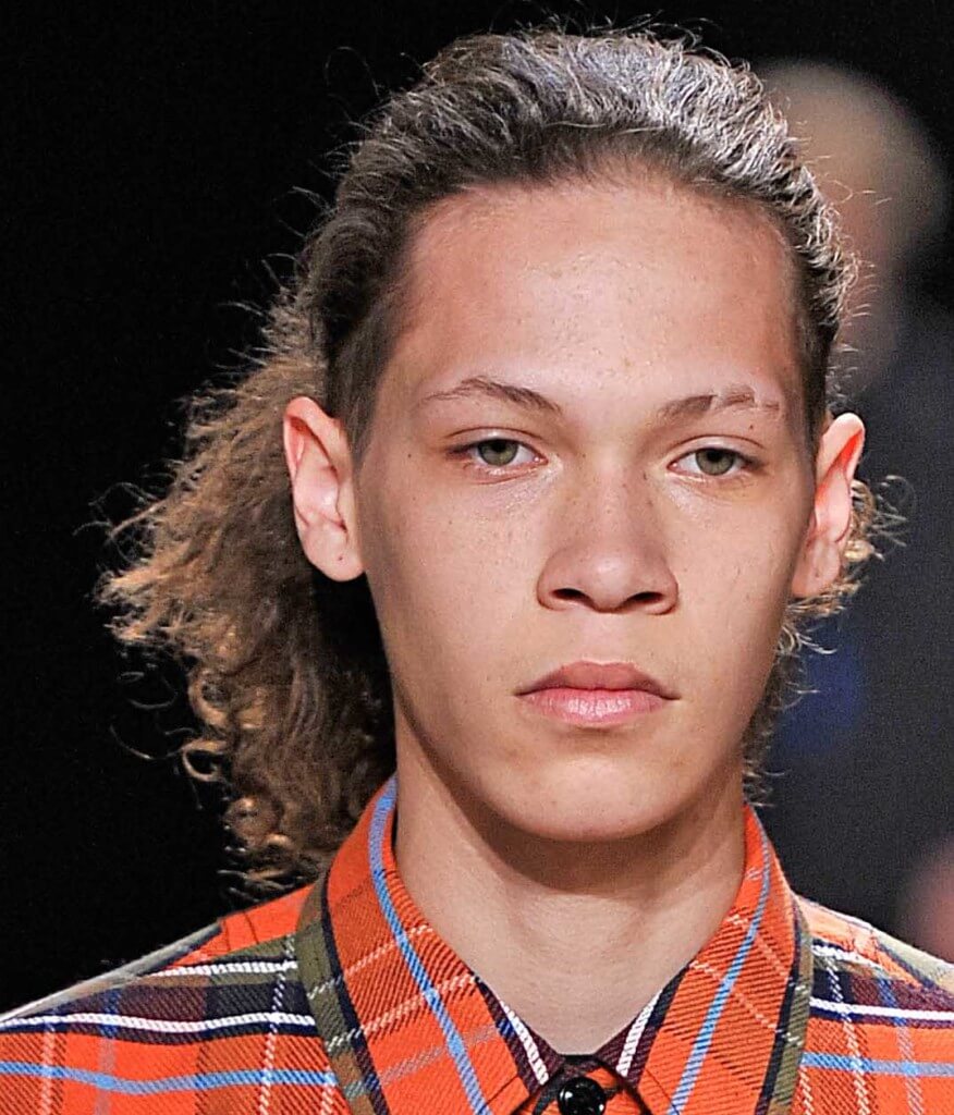 male model with brown curly mens hair crimpled