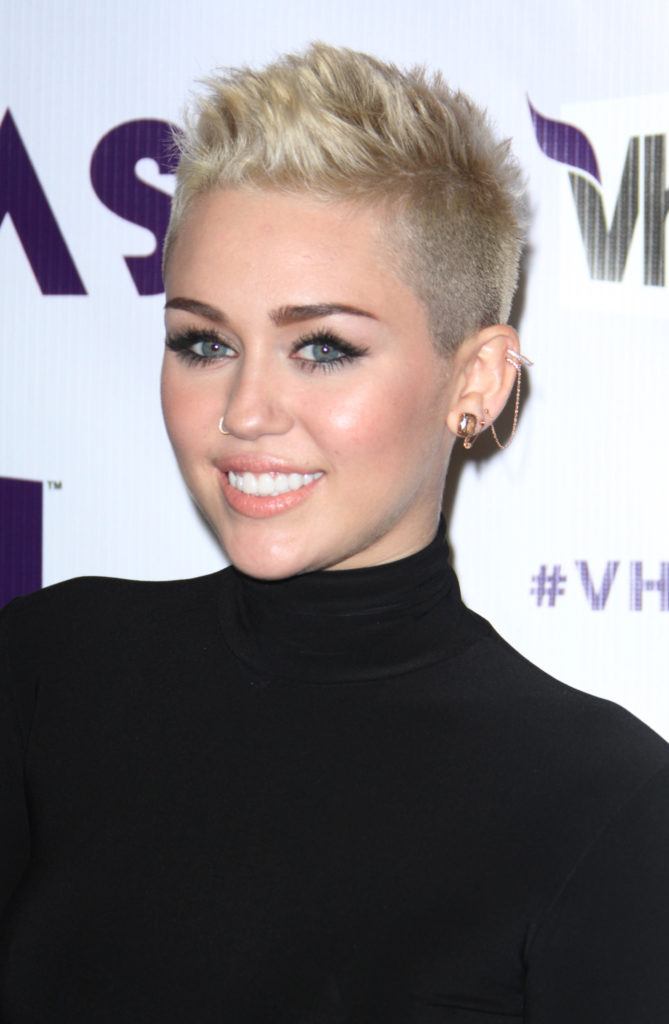 Image of Miley Cyrus with short cropped hair and black top