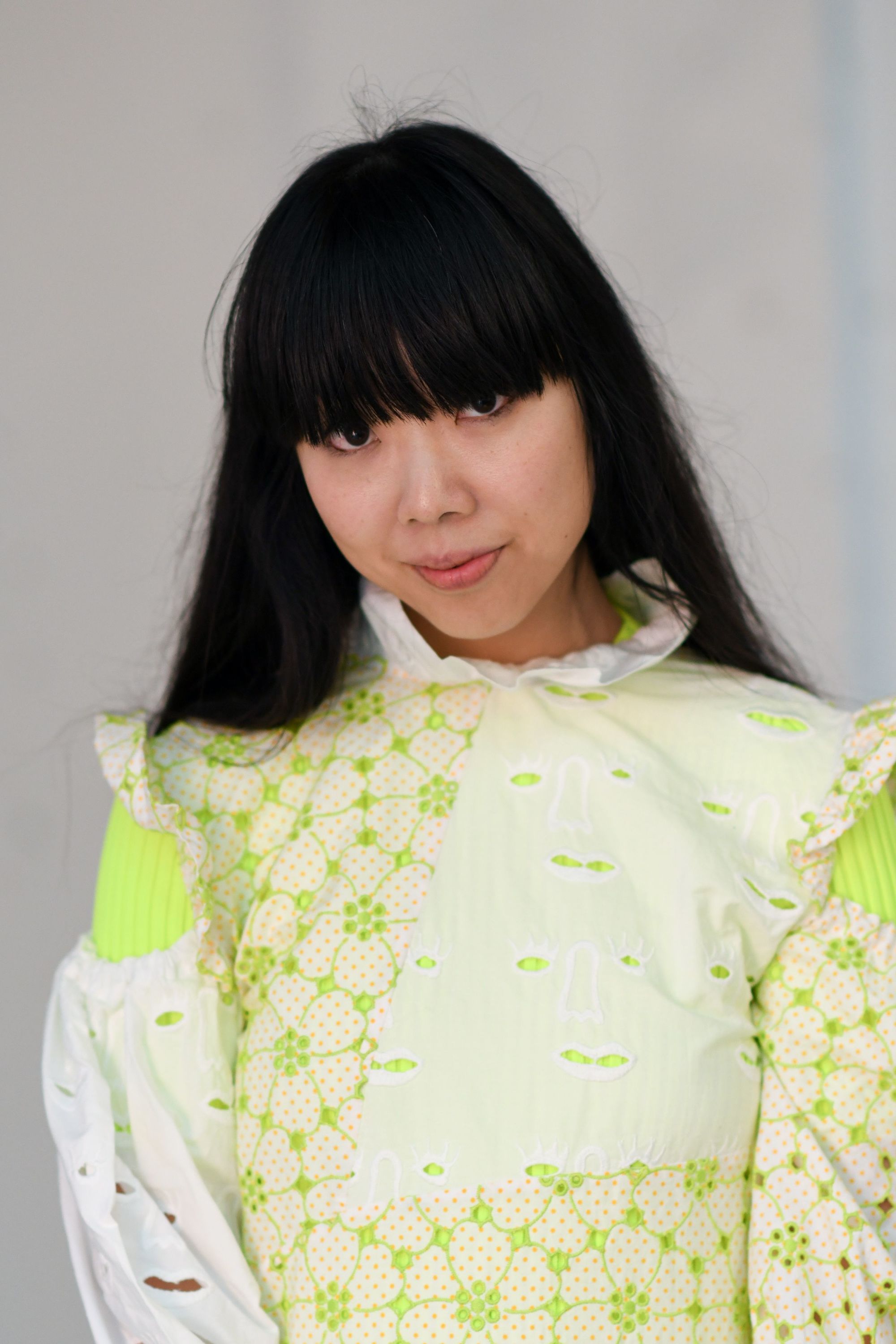 Haircuts for thick hair: Fashion blogger Susie Bubble with long dark hair with a full fringe