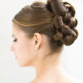Brown haired bride with a curly wedding updo