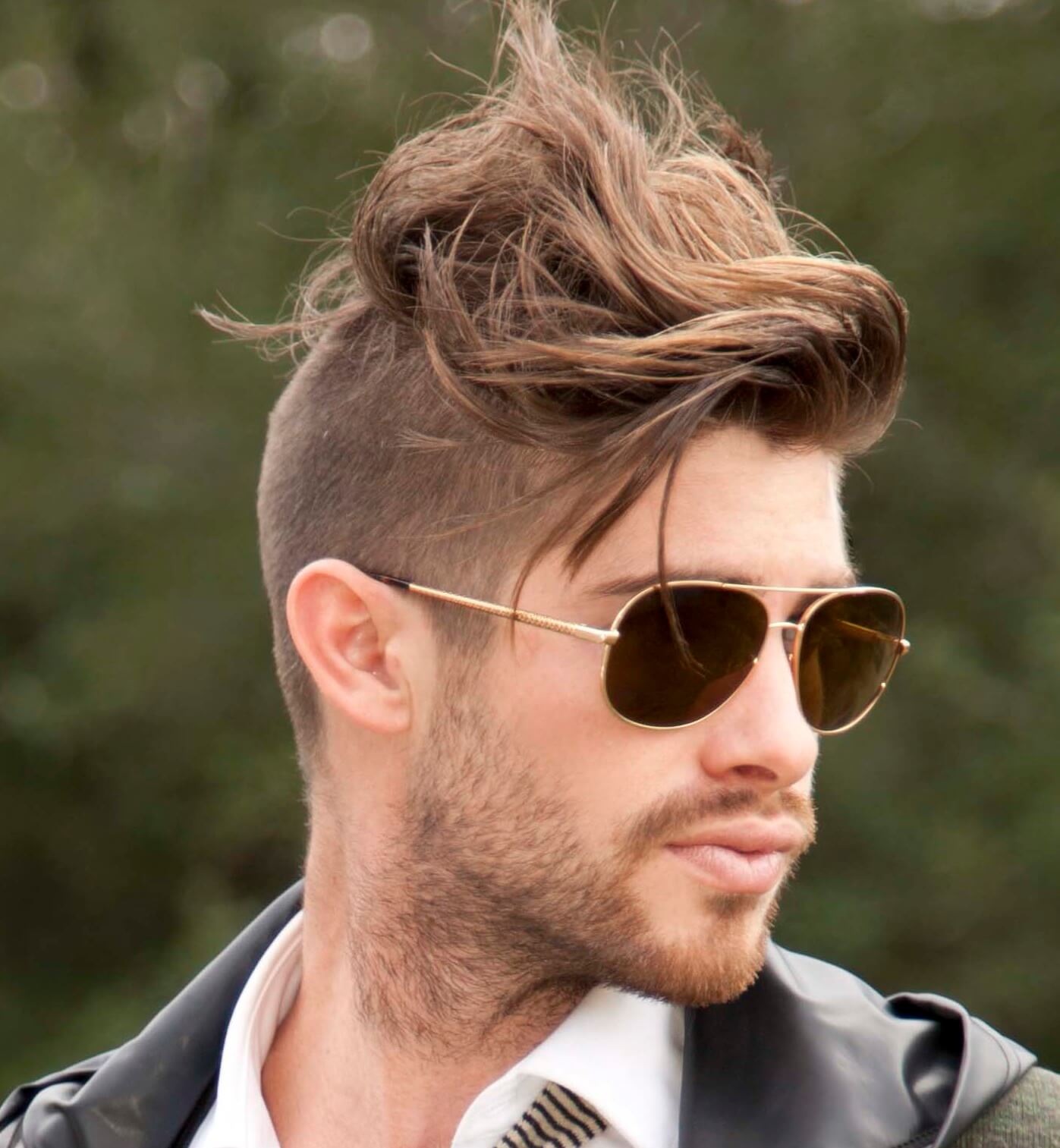 light brown haired man with windswept Mohawk