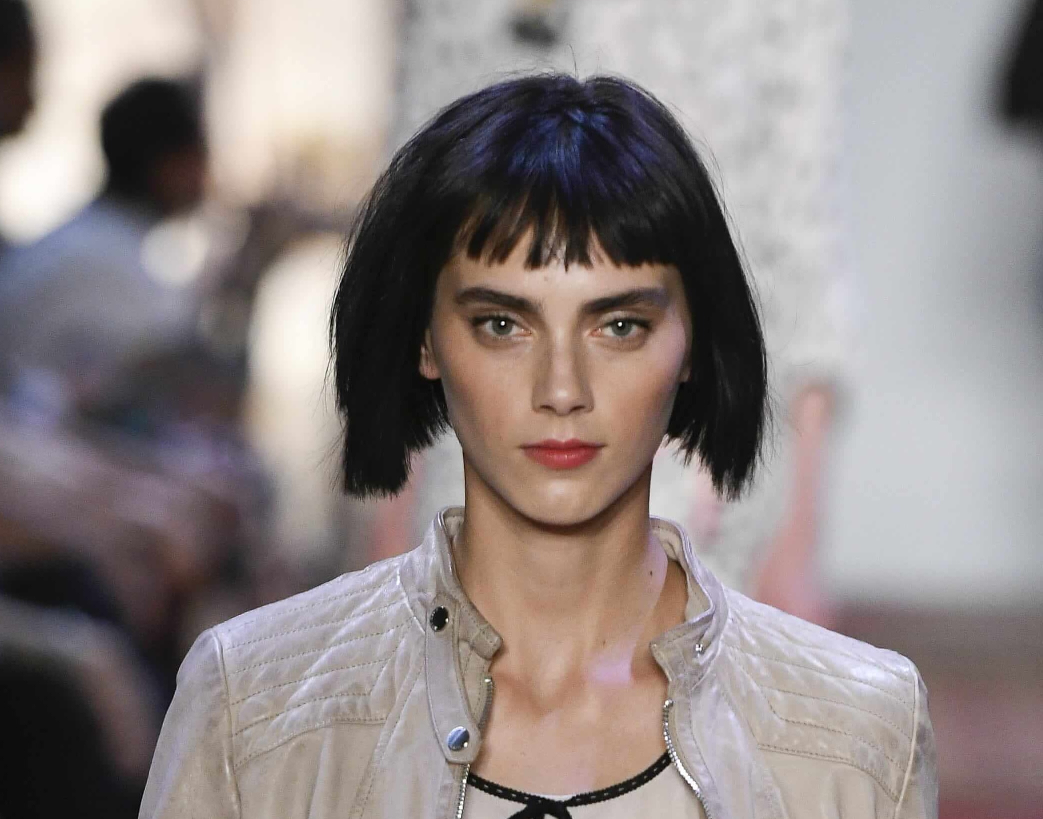 Short hairstyles for fine hair: Woman on runway with dark brown straight a-line bob and blunt fringe.