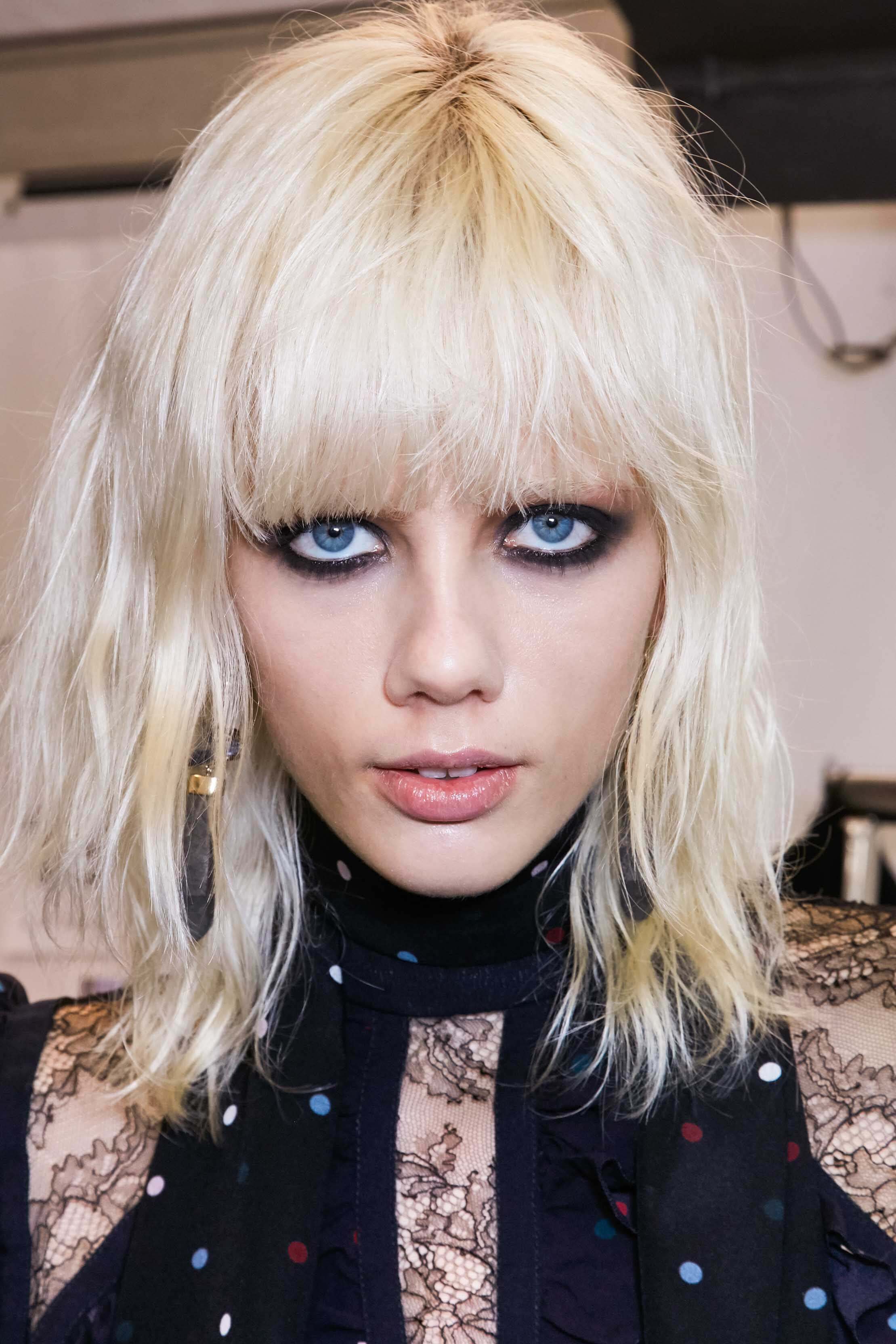 bleach blonde shaggy hair with fringe