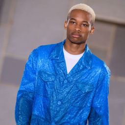 close up shot of black man with blonde high and tight, with subtle low fade, wearing blue on the juilen david runway ss18