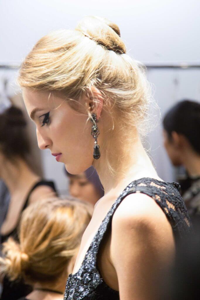 side view image of a woman with a golden-blonde-updo