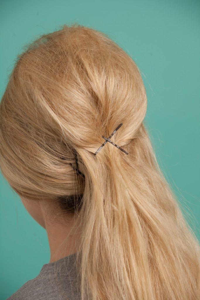 a blonde woman with her hair clipped on the backside
