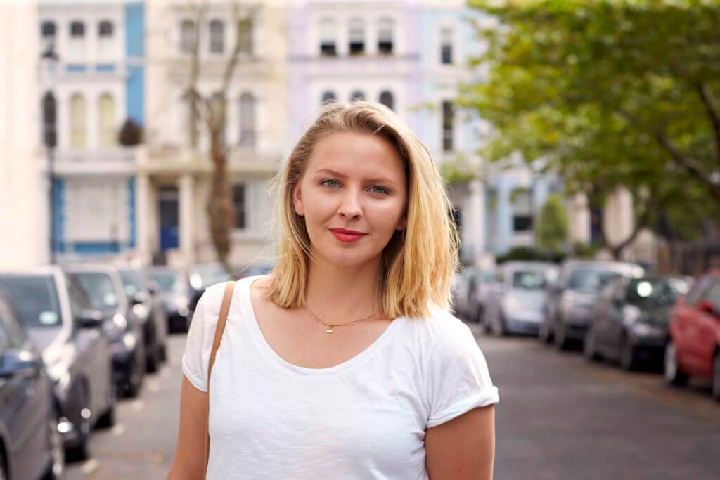 image of a woman with a sleek-golden-blonde-bob
