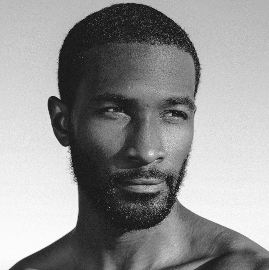 front view of a black man with a goatee and short buzz cut - black men hairstyles