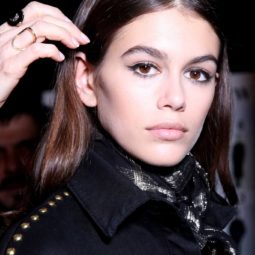 Kaia Gerber backstage image medium length brown straight hair been styled