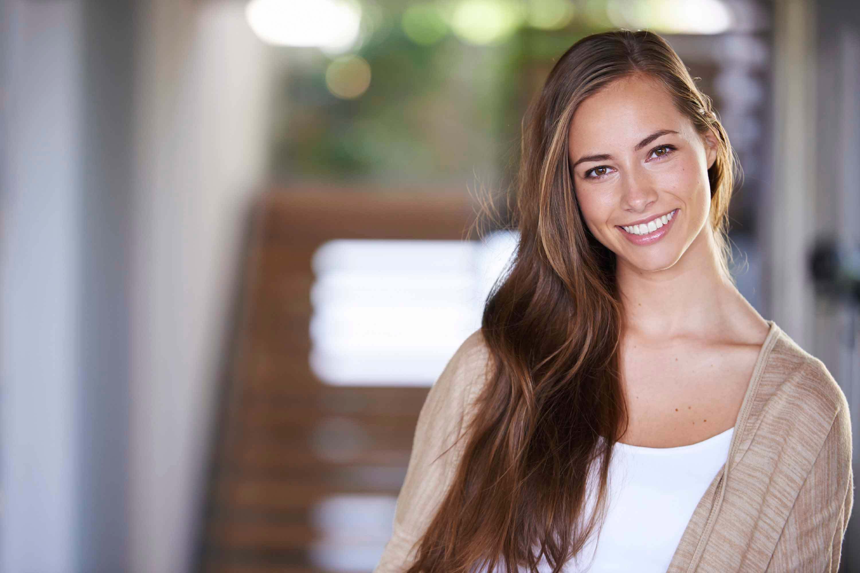 Shot of an attractive young woman with straight hair at home
