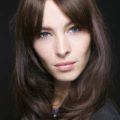 Feathered hairstyles: All Things Hair - IMAGE - dark brown haired woman with fringe, layers and feathered hair