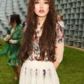 Betty Bachz at the serpentine summer party with her chocolate brown hair worn long and in waves, with blunt bangs