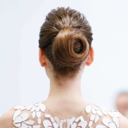 The back view of a beautifully swirled hair bun