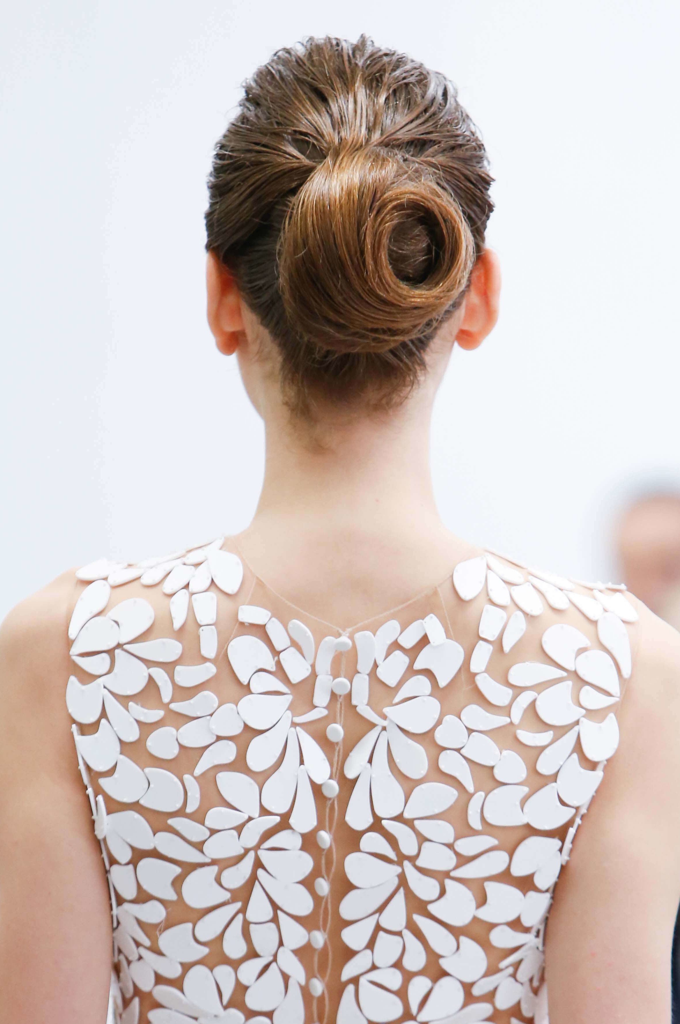 The back view of a beautifully swirled hair bun