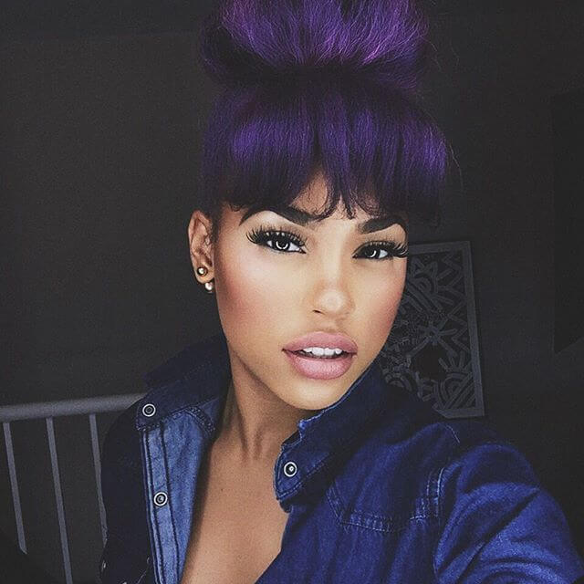 Hairstyles with fringes: purple blunt fringe and high bun