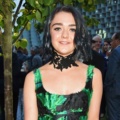 Maisie Williams at the serpentine summer party with her hair dyed a deep blue and styled into a curly bob