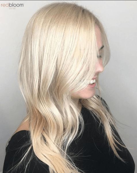 side view of a woman's hair with golden platinum blonde hair