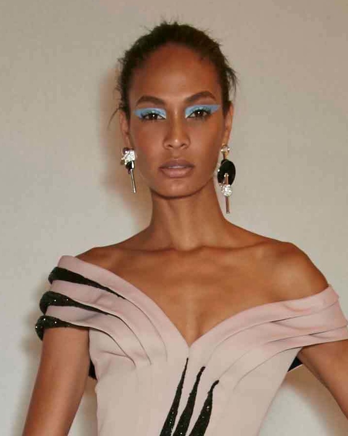 Joan smalls with wind swept hair