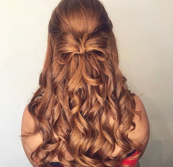 Wedding hairstyles for long hair: Auburn hair in a half-up bow curly hairstyle