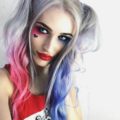 woman with light grey hair dressed as Harley Quinn