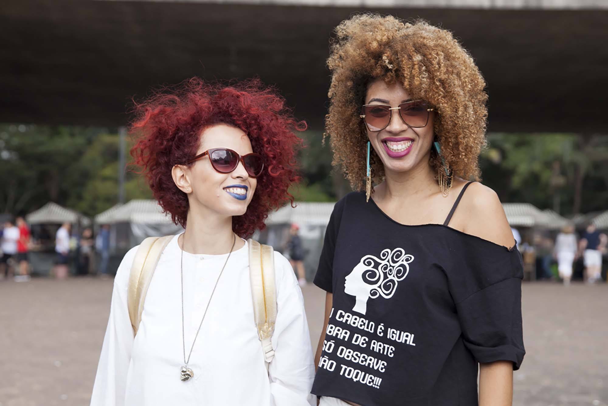 Coloured afro hair styles: 2 natural haired women with red and highlighted afro