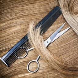 blonde hair with hair scissors and fine tooth comb
