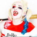 woman dressed as Harley Quinn with blonde hair and extensions