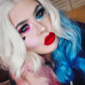 woman with blonde curly hair with blue and pink colour - Harley Quinn
