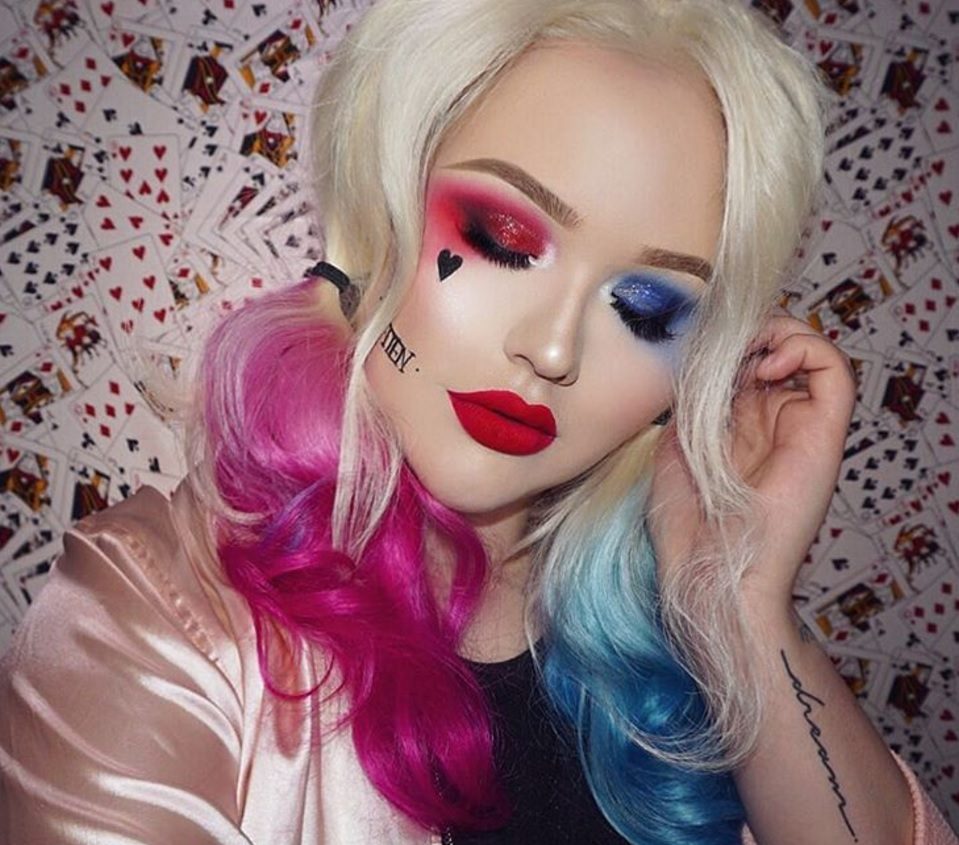 Girl wearing a Harley Quinn inspired wig with pink and blue
