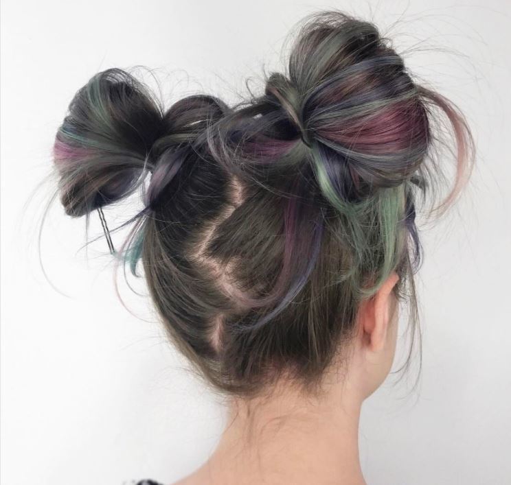 Back view of dark and colourful hair in zig zag space buns