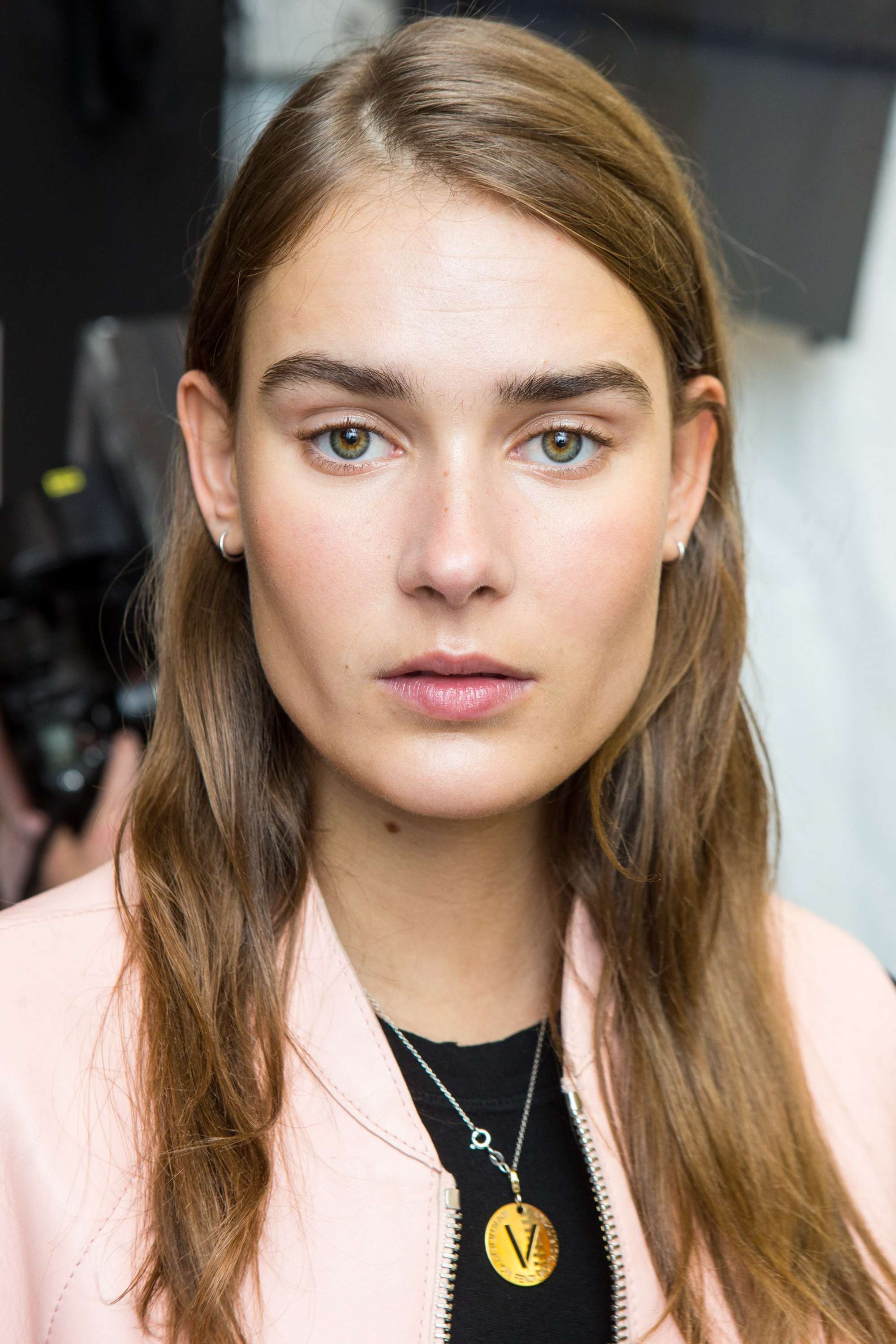 model with almond coloured light brown hair backstage