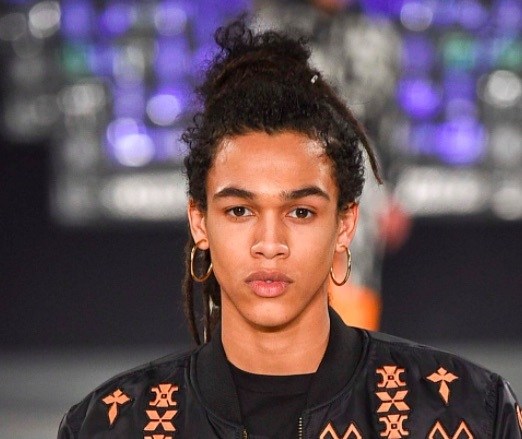 front view image of a black man with a man bun