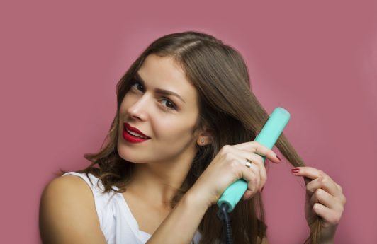 Ceramic hair straighteners: All Things Hair - IMAGE - girl straightening hair