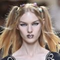 model on the Fendi SS17 runway with blonde hair worn in pigtails with candy look accessories attached and glitter lips