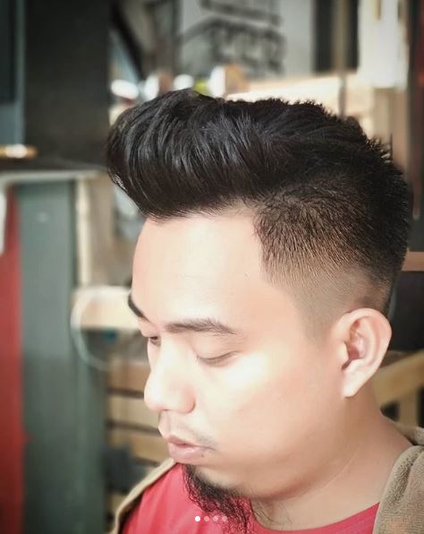 Man with contemporary and subtle dark mohawk hairstyle