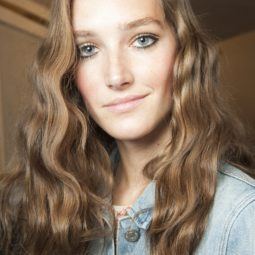model backstage with sun kissed golden brown hair