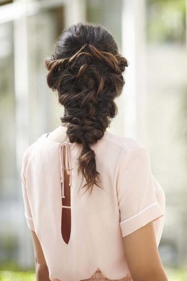 back shot of a woman with long brunette in a mermaid braid
