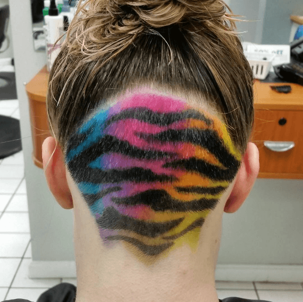 Tiger stripes rainbow colour undercut on woman with brown hair