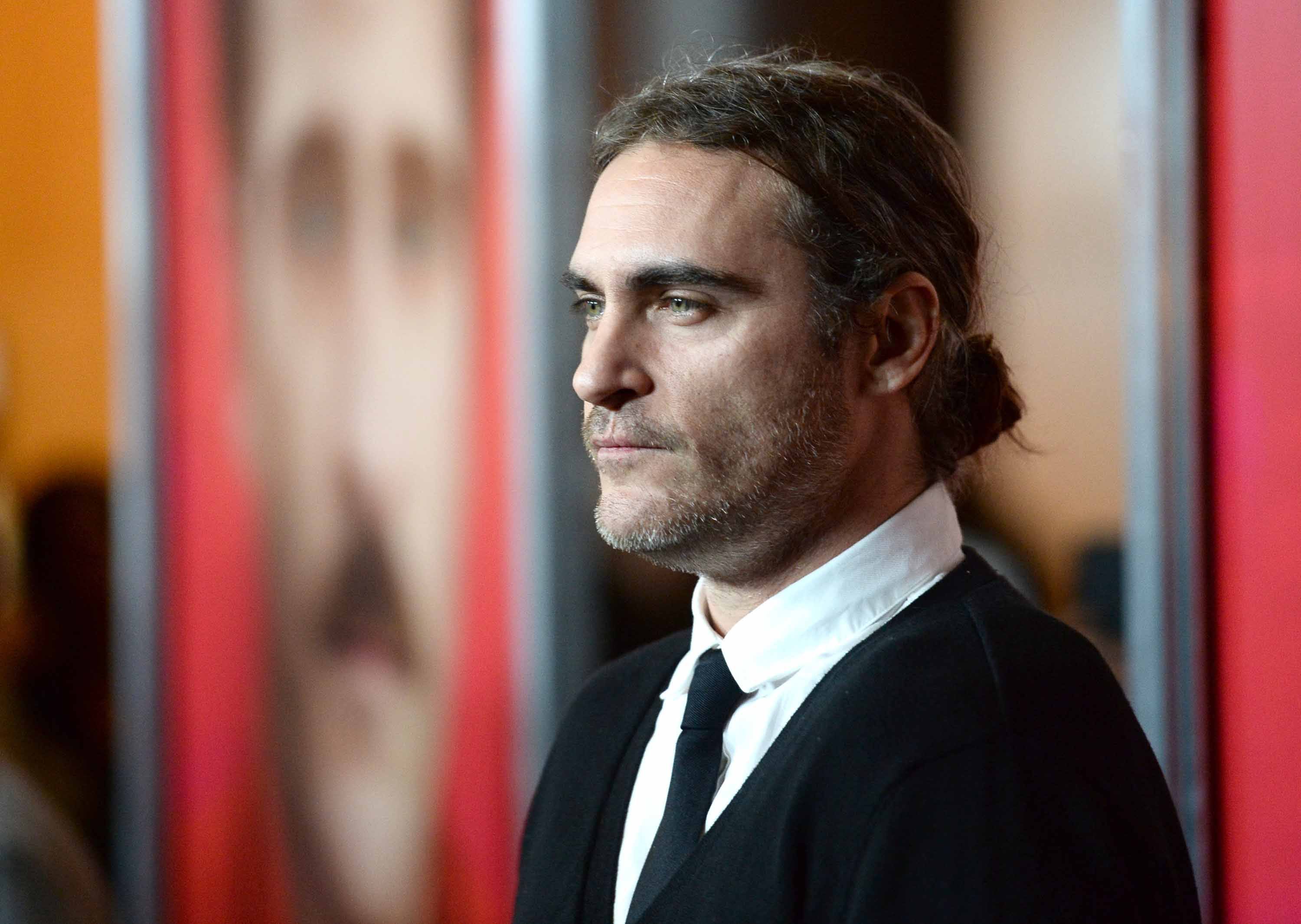 man bun Joaquin Phoenix hair