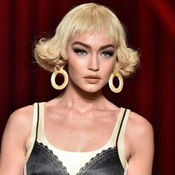 gigi hadid with a blonde curly bob on the moschino ss17 runway