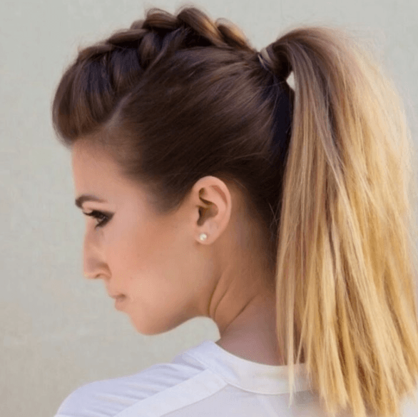 side view of a woman with her hair in a high pony tail with mini faux hawk