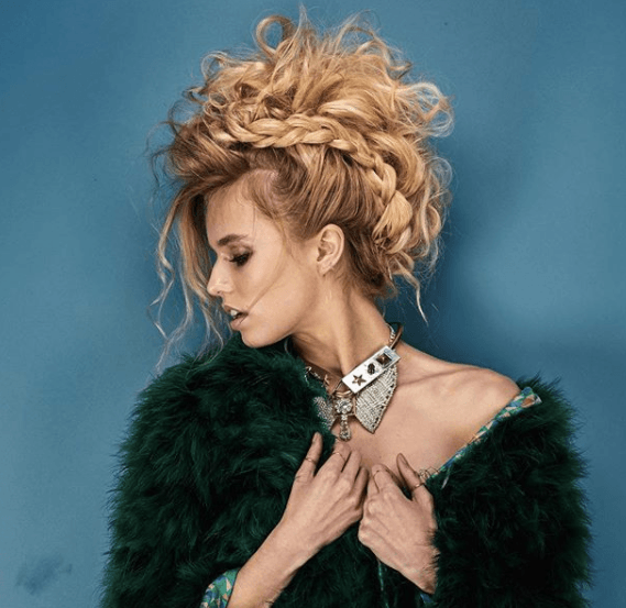 side view of a woman with a braid and wisps of hair with a faux hawk braid