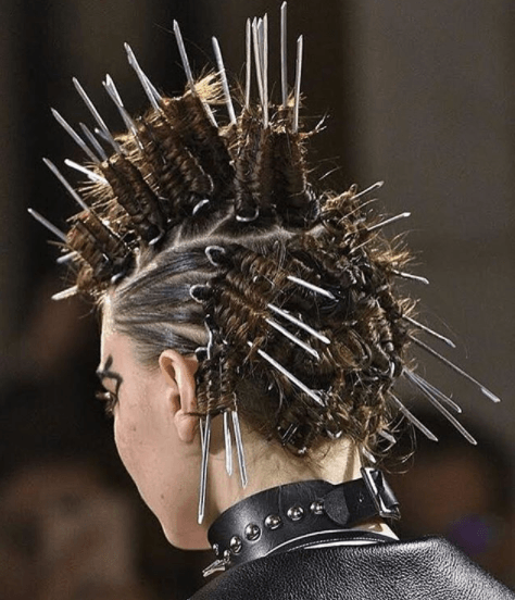 back view of a woman's hair with pins and braids - faux hawk braid
