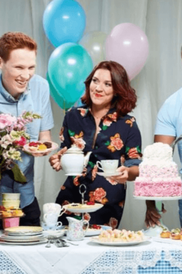 Jane Beedle, Candice Brown and other Great British Bake Off contestants sampling cake son a table